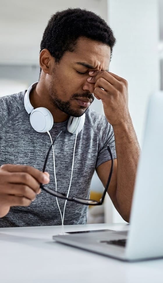 A client looking discouraged at a laptop